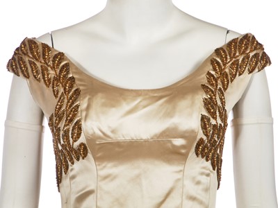 Lot 461 - A Norman Hartnell couture ivory satin evening gown, mid-1950s