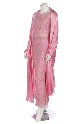 Lot 456 - A Norman Hartnell couture embellished pink chiffon evening dress, 1960s