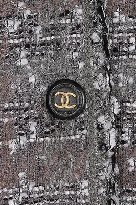 Lot 68 - A Chanel grey and silver tweed jacket, 1994,...