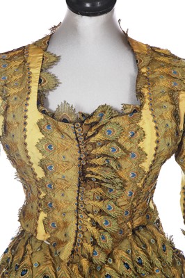 Lot 416 - An unusual yellow 'peacock' evening gown, circa 1875