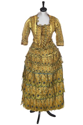 Lot 416 - An unusual yellow 'peacock' evening gown, circa 1875