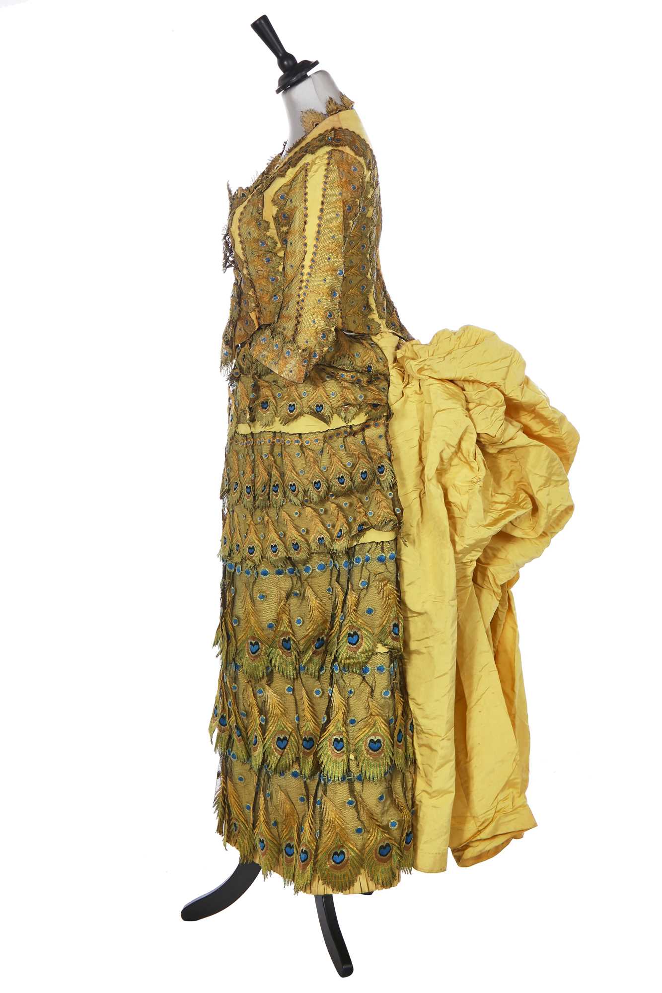 Lot 416 - An unusual yellow 'peacock' evening gown, circa 1875