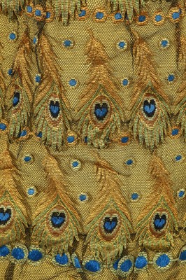Lot 416 - An unusual yellow 'peacock' evening gown, circa 1875