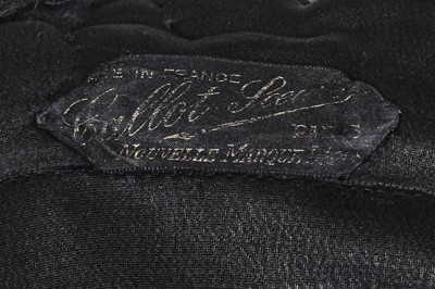 Lot 469 - A Callot Soeurs black satin-backed crepe evening coat, late 1920s