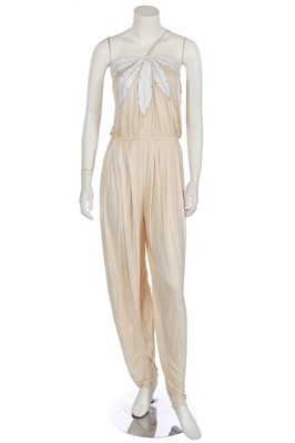 Lot 368 - A rare and early Gianni Versace cream jersey jumpsuit, 'Colonial Collection', Spring-Summer 1981