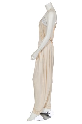 Lot 368 - A rare and early Gianni Versace cream jersey jumpsuit, 'Colonial Collection', Spring-Summer 1981
