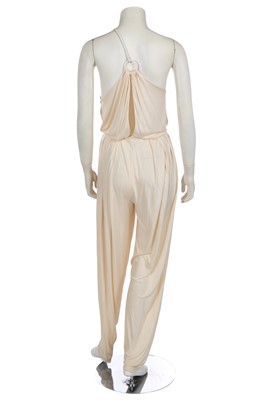 Lot 368 - A rare and early Gianni Versace cream jersey jumpsuit, 'Colonial Collection', Spring-Summer 1981
