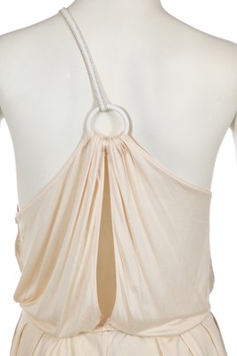 Lot 368 - A rare and early Gianni Versace cream jersey jumpsuit, 'Colonial Collection', Spring-Summer 1981