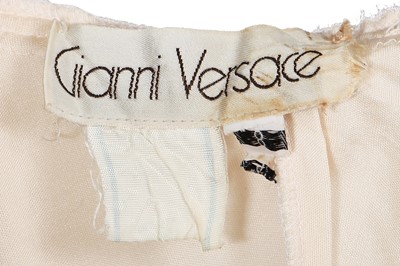 Lot 368 - A rare and early Gianni Versace cream jersey jumpsuit, 'Colonial Collection', Spring-Summer 1981