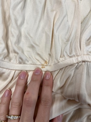 Lot 368 - A rare and early Gianni Versace cream jersey jumpsuit, 'Colonial Collection', Spring-Summer 1981