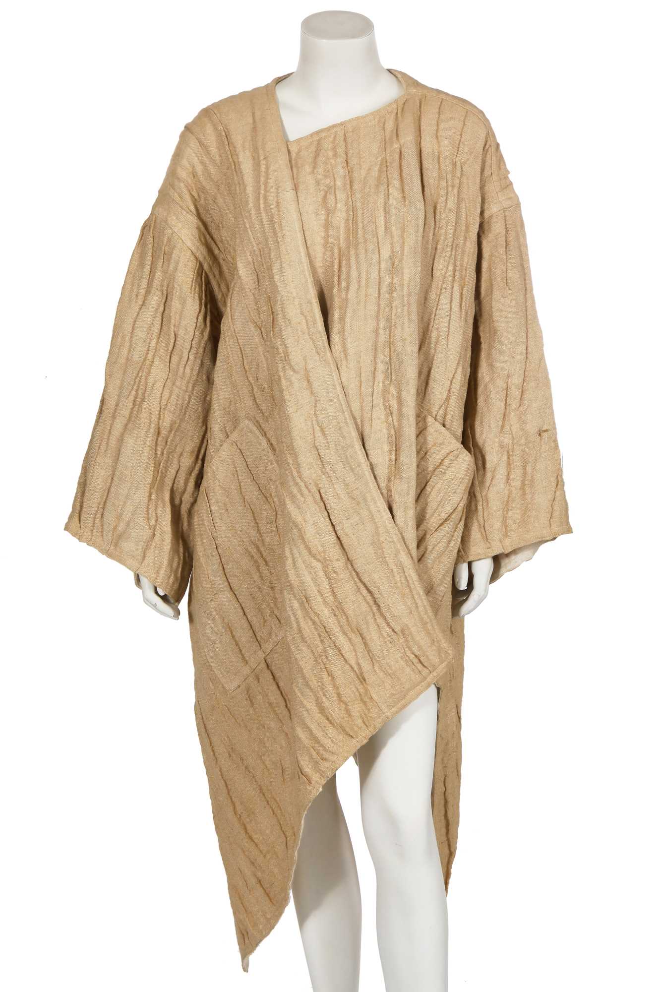 Lot 144 - An Issey Miyake crinkle textured tan linen coat, Autumn-Winter 1984-85