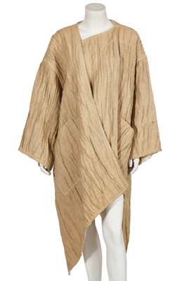 Lot 144 - An Issey Miyake crinkle textured tan linen coat, circa 1984