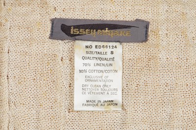 Lot 144 - An Issey Miyake crinkle textured tan linen coat, Autumn-Winter 1984-85