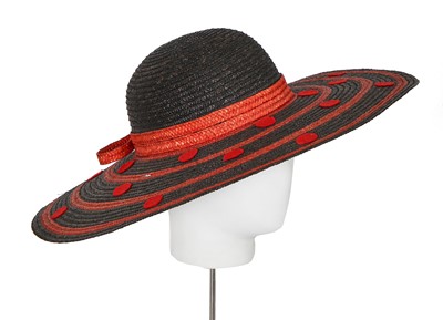 Lot 394 - A group of Yves Saint Laurent summer hats, 1970s-1980s