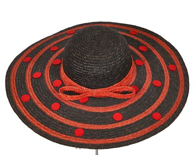 Lot 394 - A group of Yves Saint Laurent summer hats, 1970s-1980s