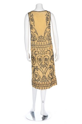Lot 85 - An Adair beaded yellow silk flapper dress,...