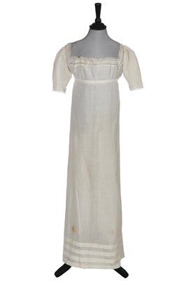 Lot 507 - A woven white cotton girl's dress, 1815-20