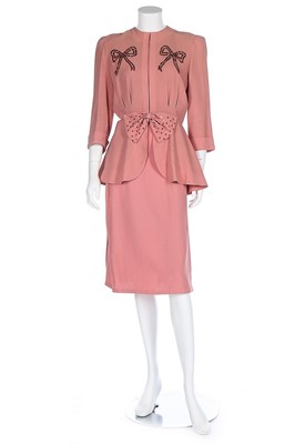 Lot 86 - A pink crêpe ensemble embellished with...