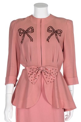 Lot 86 - A pink crêpe ensemble embellished with...