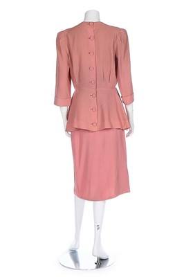 Lot 86 - A pink crêpe ensemble embellished with...