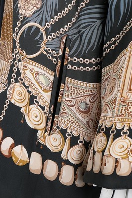 Lot 92 - An Hermès reversible printed silk and wool...