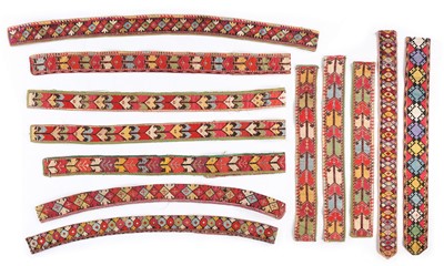 Lot 426 - Uzbek embroidered bands formed into belts in...