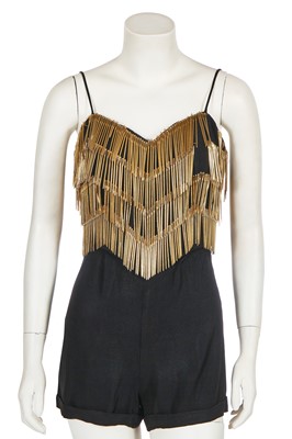 Lot 331 - Shingai of 'The Noisettes' stage-worn Moschino fringed black crêpe playsuit, circa 2009