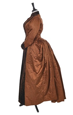 Lot 498 - A brown silk and velvet day dress, circa 1880