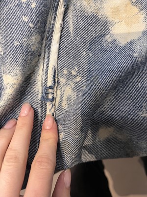 Lot 85 - An Alexander McQueen men's bleached denim coat, 'It's a Jungle Out There' collection, Autumn-Winter 1997-98