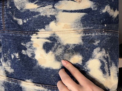 Lot 85 - An Alexander McQueen men's bleached denim coat, 'It's a Jungle Out There' collection, Autumn-Winter 1997-98