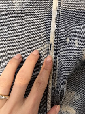 Lot 85 - An Alexander McQueen men's bleached denim coat, 'It's a Jungle Out There' collection, Autumn-Winter 1997-98