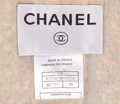 Lot 135 - A Chanel pale pink cotton tweed suit, 2005,...