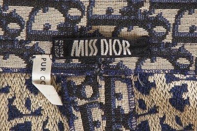 Lot 222 - A Christian Dior 'Trotter' logo-woven cotton A-line skirt, 1960s