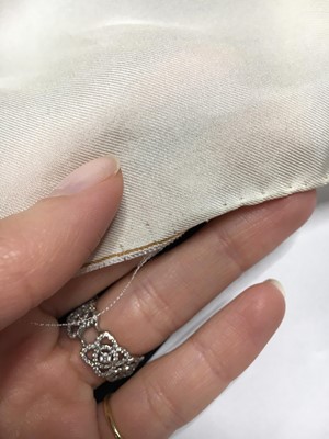 Lot 386 - A rare and early Hubert de Givenchy trompe-l'œil hair-printed silk headscarf, Spring-Summer 1953