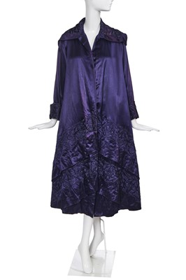 Lot 414 - An important and early Gabrielle Chanel haute couture embroidered midnight blue satin coat, 1917