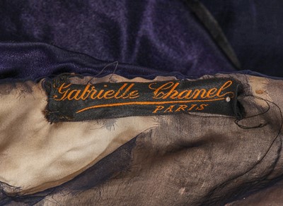 Lot 414 - An important and early Gabrielle Chanel haute couture embroidered midnight blue satin coat, 1917