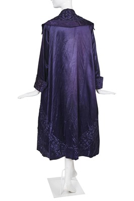 Lot 414 - An important and early Gabrielle Chanel haute couture embroidered midnight blue satin coat, 1917