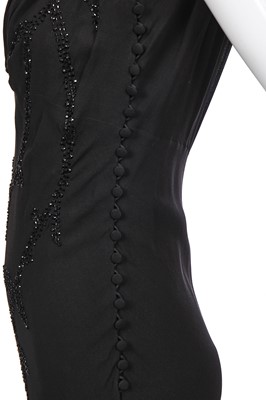 Lot 180 - A John Galliano beaded black crêpe georgette evening dress, 'The Family That Eats Together Stays Together' collection, Autumn-Winter 2007-08