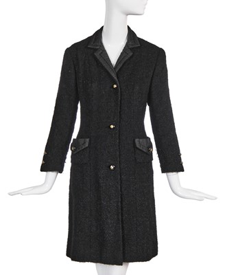 Lot 22 - A Chanel haute couture black bouclé wool coat, late 1960s-early 70s