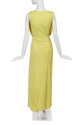 Lot 353 - A Madame Grès haute couture primrose jersey evening gown, circa 1963