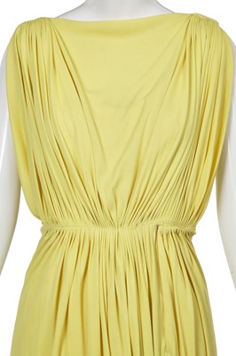 Lot 353 - A Madame Grès haute couture primrose jersey evening gown, circa 1963