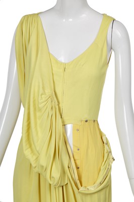 Lot 353 - A Madame Grès haute couture primrose jersey evening gown, circa 1963