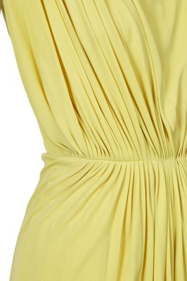 Lot 353 - A Madame Grès haute couture primrose jersey evening gown, circa 1963