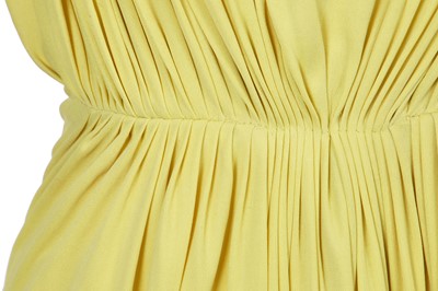 Lot 353 - A Madame Grès haute couture primrose jersey evening gown, circa 1963