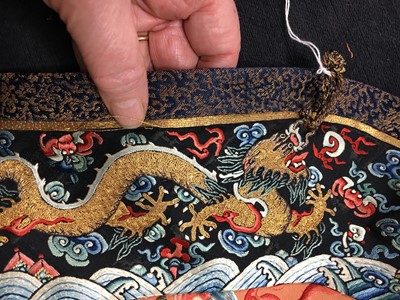 Lot 426 - A woman's finely embroidered apricot-yellow dragon robe, jifu, Chinese, early 19th century