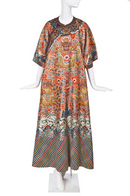 Lot 426 - A woman's finely embroidered apricot-yellow dragon robe, jifu, Chinese, early 19th century