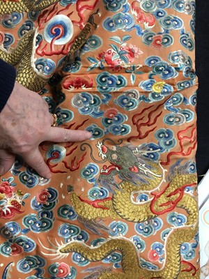 Lot 426 - A woman's finely embroidered apricot-yellow dragon robe, jifu, Chinese, early 19th century