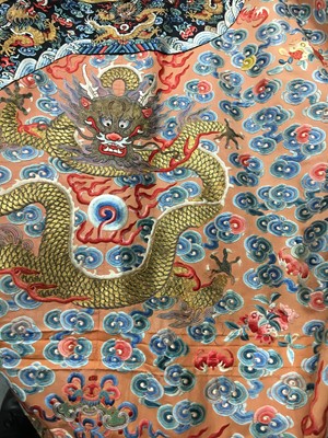 Lot 426 - A woman's finely embroidered apricot-yellow dragon robe, jifu, Chinese, early 19th century