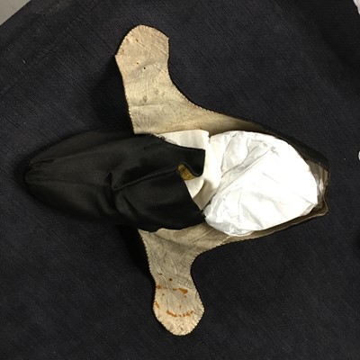 Lot 423 - A pair of black satin shoes and a pair of unusual brown leather pattens, 1770-1780