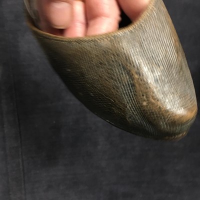 Lot 423 - A pair of black satin shoes and a pair of unusual brown leather pattens, 1770-1780